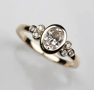 Oval Bezel-set Seven Stone Cluster Ring